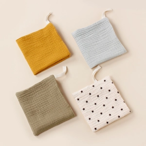 Set of 4 muslin cotton baby face towels in earthy tones with convenient hanging loops
