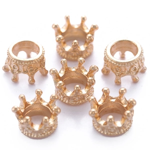 Detailed view of six golden alloy crown pendants for DIY jewelry making and necklaces