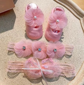 Pink lace baby headband and knit socks set with oversized flower and bow details