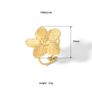 Macro detail of golden flower ring with 25mm petal width and twisted adjustable band