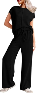 Detailed view of the black ribbed fabric texture and high waist drawstring on these pants
