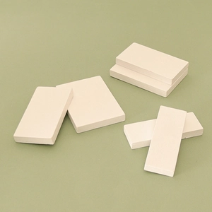 Set of rectangular wooden planks for DIY miniature dollhouse stair models on green background