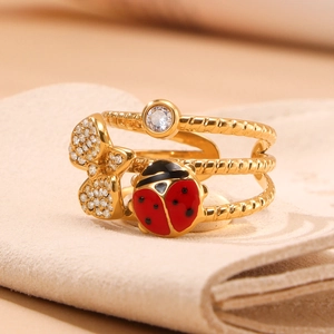 Three-layer gold steel ring featuring enamel ladybug and zircon bow knot details