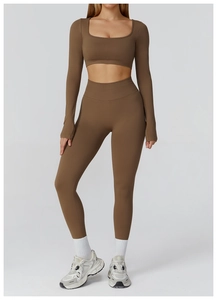Detail of high-waist yoga leggings with scrunch butt design in deep brown fabric