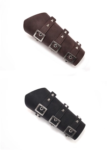 Detailed look at vintage leather arm guards with metal buckles and pyramid studs