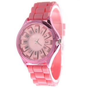 Detail of pink silicone watch featuring 3D textured dial and metallic bezel