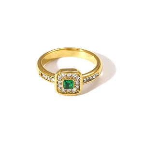 Close-up of gold 18K square green zircon ring with sparkling diamond pave accents