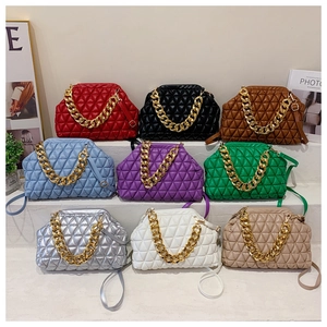 Quilted shell bag display featuring nine colors with gold chain straps and sleek finish