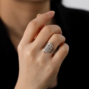 Silver stainless steel double-layer Wicca knot Celtic ring worn on model's hand