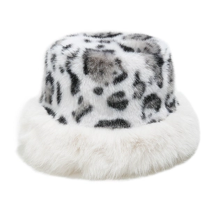 Detail of leopard print faux fur bucket hat with thick white plush lining and soft texture