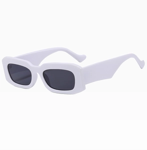 Detail view of square sunglasses featuring wide white frames and thick temples