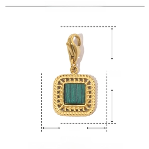 Macro detail of a 25mm green natural stone pendant with golden stainless steel frame