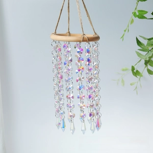 Detail of wooden ring wind chime with iridescent AB crystal beads and teardrop prism