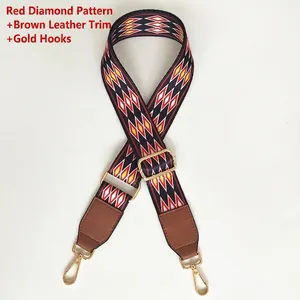 Close-up of ethnic red argyle wide bag strap with brown leather and gold metal clips