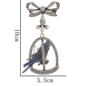 Detailed dimensions of a vintage parrot brooch with crystal bow and hollow birdcage