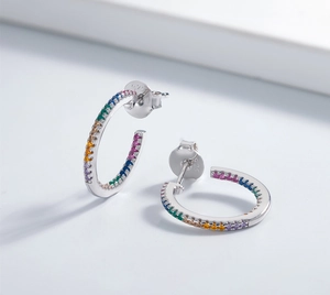 Detailed close-up of 925 sterling silver earrings with rainbow zircon stones and S925 stamp