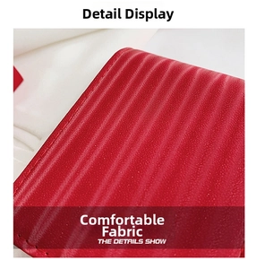 Close-up of the red wavy textured fabric with premium stitching on a mini makeup bag
