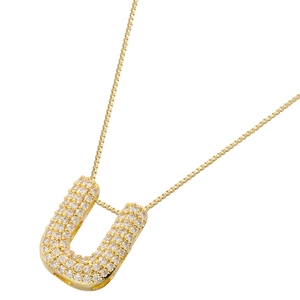 Detailed close-up of a gold-plated letter U pendant with shiny cubic zirconia stones