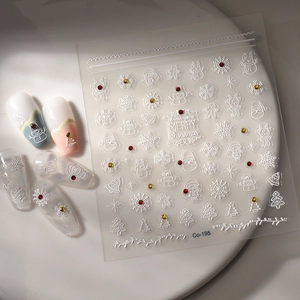 Detail showing 5D embossed Christmas nail stickers with Santa and snowflake designs