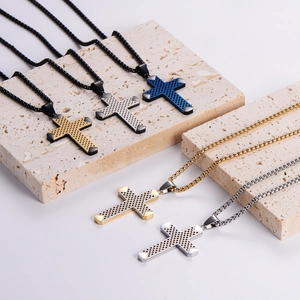 Five assorted stainless steel cross pendant necklaces with textured grid patterns