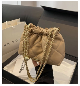 Quilted drawstring bucket bag in khaki leather with gold chain in a gift box