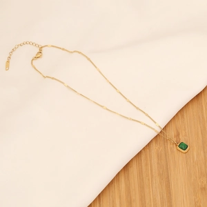 Detail of square emerald pendant on gold stainless steel chain with adjustable S925 clasp