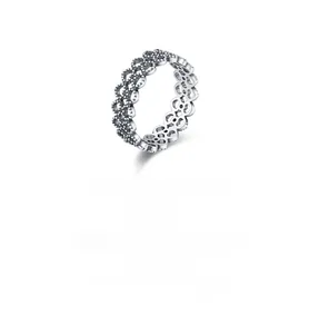 Macro shot of S925 sterling silver ring featuring openwork hearts and zircon settings