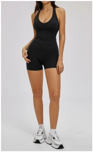 Slim fit black ribbed yoga set featuring a deep V-neck tank top and high waist shorts