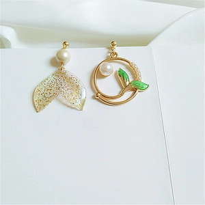 Asymmetric dolphin tail earrings with sparkling sequins, green accents and white pearls