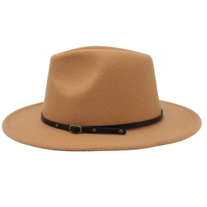 Detail of camel wool fedora hat featuring black leather band and gold buckle accents