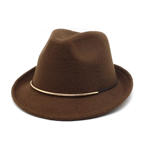 Detail of dark brown wool fedora hat featuring black band and golden metal buckle accent