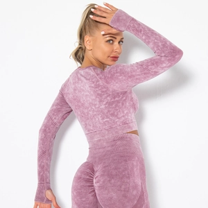 Detail of pink acid wash long sleeve yoga top with thumbholes and high waist leggings