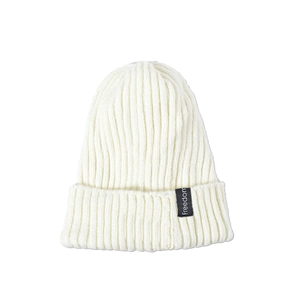 Detailed close-up of white ribbed knit beanie featuring a black Freedom brand label
