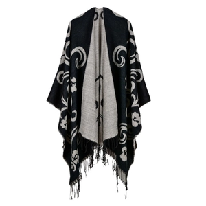 Black and grey floral knit poncho shawl with bohemian jacquard pattern and fringe trim