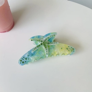 Starfish acetate hair claw clip with gradient blue yellow finish and green rhinestones