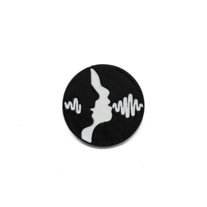 Creative enamel medical badge featuring a minimalist black and white face silhouette profile