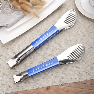 Two-piece stainless steel food tongs set with hollow design on beige placemat