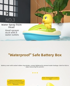 Detail view of yellow duck motorboat bath toy showing 8 water holes and waterproof battery case