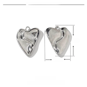 Macro view of polished stainless steel heart pendant showing 18mm by 15mm dimensions