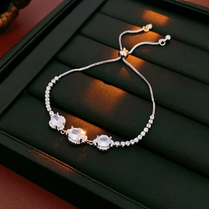 Detailed shot of adjustable silver flower bracelet with oval zircons and box chain