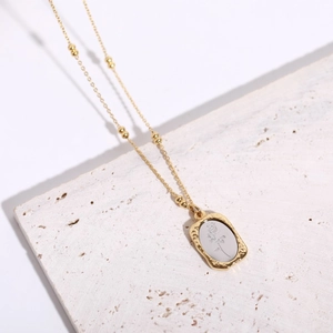 Vintage 18K gold plated stainless steel rose flower pendant necklace on stone