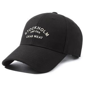 Black cotton baseball cap with white Stockholm lettering and classic curved brim