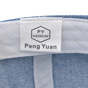 Detailed inner view of washed denim baseball cap with white sweatband and brand label