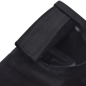 Macro detail of the black twill fabric and stitching on an adjustable baseball cap