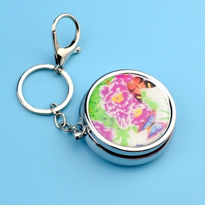 Portable metal pill box keychain with colorful peony and butterfly floral patterns