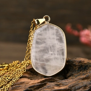 Vintage gold plated stainless steel necklace with natural pink crystal pendant detail
