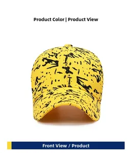 Front view of yellow cotton baseball cap with artistic black paint splatter graffiti