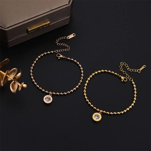 Elegant K18 rose gold and gold beaded bracelets with Roman numeral crystal pendants