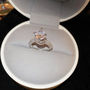 Macro shot of silver ring with zircon stones in a gift box showing luxury craftsmanship
