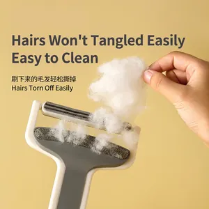 Manual lint remover and pet hair brush for clothes and furniture cleaning on yellow background